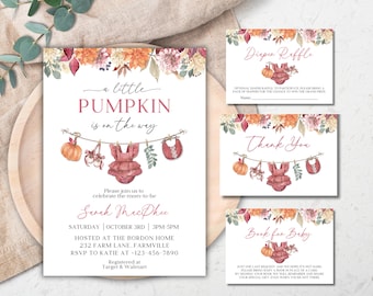 May include: A set of baby shower invitation cards featuring watercolour autumn floral accents, a pumpkin, and baby clothing hanging on a clothesline. The text includes A LITTLE PUMPKIN IS ON THE WAY, Diaper Raffle, Thank You, and Book for Baby.