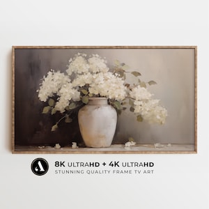 May include: A framed painting of a white flower bouquet in a white vase against a grey background. The painting is in a brown frame.