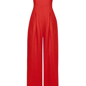 May include: A strapless red jumpsuit with wide legs and a relaxed fit.