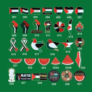May include: A collection of enamel pins with various designs, including flags, hearts, fists, birds, watermelon slices, and ribbons. Some pins feature the text "FREE" and "PALESTINE". The pins are set against a green background.
