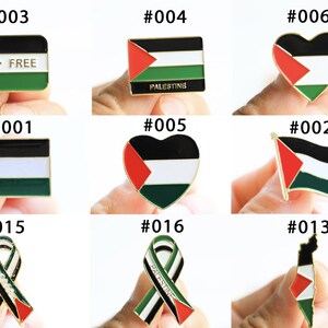 May include: Collection of Palestine flag pins in various shapes, including square, rectangle, heart, and ribbon designs. The pins feature the colors red, white, black, and green, with some including the word "FREE" or "PALESTINE".