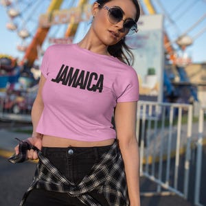 Pink T-Shirt Bold Jamaica lettering in black. Highlighting the Caribbean and Jamaican vibes for women