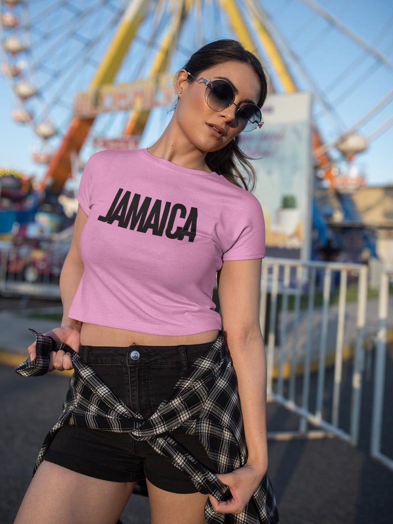 Pink T-Shirt Bold Jamaica lettering in black. Highlighting the Caribbean and Jamaican vibes for women
