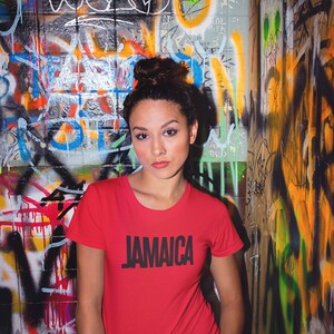 Red T-Shirt Bold Jamaica lettering in black. Highlighting the Caribbean and Jamaican vibes for women