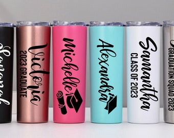 May include: Six stainless steel tumblers with personalized graduation messages. The tumblers are in black, rose gold, pink, turquoise, white, and silver. The messages include names, graduation year, and phrases like "Class of 2023" and "Graduation Squad 2023".