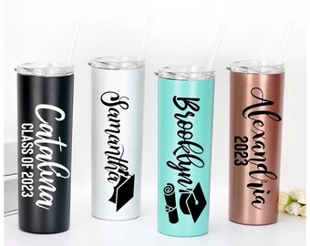 May include: Four personalized stainless steel tumblers with black lids and straws. The tumblers are black, silver, turquoise, and rose gold. Each tumbler has a name and the year 2023 printed on it. The names are Catalina, Samantha, Brooklyn, and Alexandria.