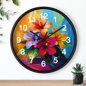 May include: A black round wall clock with a colorful floral design. The clock face features white numbers and black hands. The floral design includes pink, yellow, purple, and red flowers.