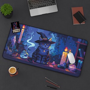 May include: A black cat wearing a witch's hat sits on a table with candles, crystals, and other magical items. The background is a dark forest with a blue and purple sky. The mouse mat is designed with a vibrant, pixelated style.