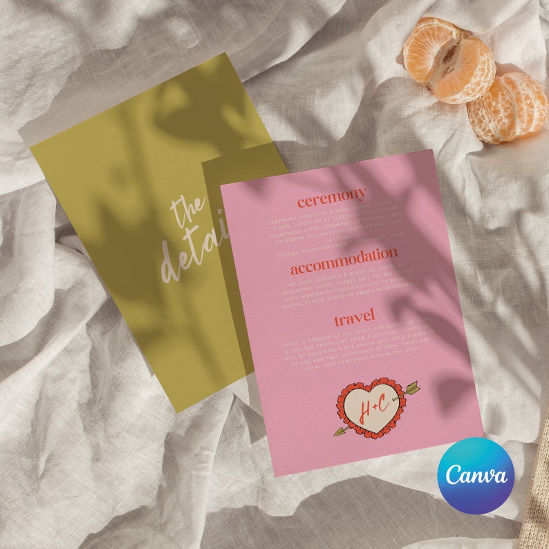 May include: Pink wedding invitation card with the text "ceremony", "accommodation", "travel" and a heart with the initials "H+C" in red. The card is on a white fabric background.