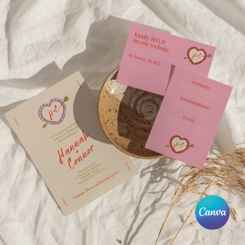 May include: A wedding invitation with a cream background and a pink heart with an arrow through it. The text reads "We're getting married! Join us to celebrate the wedding of Hannah + Connor. 15th March 2023 at 2pm in the afternoon, Stustoke Barns, Warwickshire, WV12 341. www.website.com. Champagne, Dinner and Dancing to follow!"