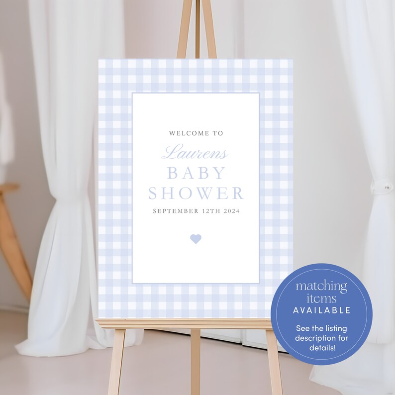 May include: A blue and white gingham baby shower welcome sign with the text "Welcome to Laurens Baby Shower September 12th 2024". A small blue heart is in the bottom center of the sign. A blue circle with the text "matching items AVAILABLE See the listing description for details!" is in the bottom right corner of the image.
