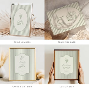 May include: A collection of wedding stationery with a vintage aesthetic. Includes table numbers, a thank you card, a card and gift sign, and a custom sign. Each piece features a striped background with an oval design and floral accents. The color palette is soft green and cream.