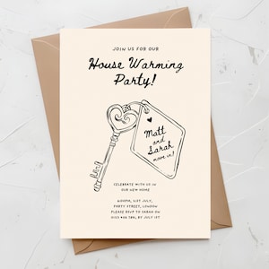 May include: A black and white housewarming party invitation with a hand-drawn illustration of a key with a heart-shaped keyhole and a tag that says "Matt and Sarah move in!" The invitation includes the date, time, and address of the party.