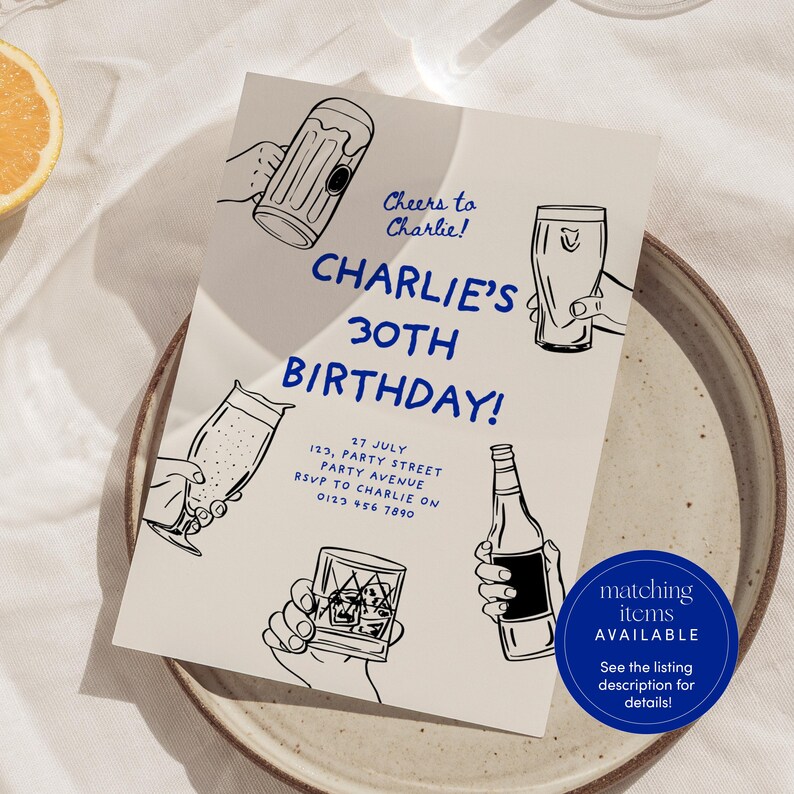 May include: A beige invitation card with blue text that reads "Cheers to Charlie! Charlie's 30th Birthday!"  The card features illustrations of various drinks, including a beer mug, a glass of beer, a glass of wine, and a glass of whiskey. The text also includes the date, address, and RSVP information.