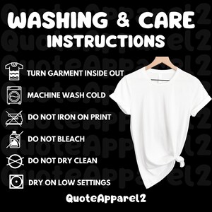 May include: A white t-shirt hanging on a wooden hanger, with washing and care instructions displayed on the left. The instructions include turning the garment inside out, machine washing cold, and not ironing on the print. The brand name "QuoteApparel2" is at the bottom.