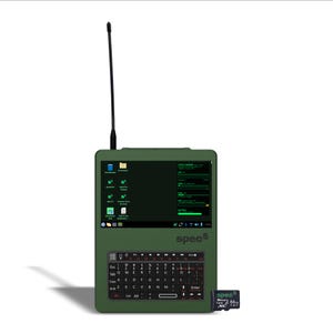 May include: An olive green handheld computer with a vertical antenna, a QWERTY keyboard, and a screen displaying system information and the text spec5. A small black 64GB memory card is positioned next to the device on the lower right side.