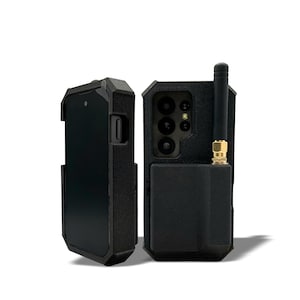 May include: Two black smartphone cases. One case is open, displaying the phone screen. The other case is closed, with a visible camera array and an antenna. The cases have a rugged, textured design.