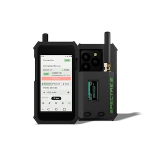 May include: A black smartphone case with a built-in antenna and a screen displaying connection information. The case has a compartment for a phone with multiple cameras. The text "SPECTRE 2" is visible.