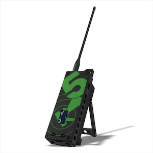 May include: Black electronic device with a green graphic of the number 5 and a circular design. It has a small screen and a black antenna. The device is propped up by a stand.
