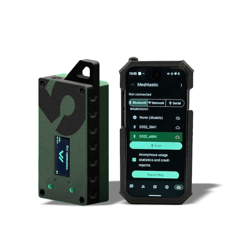 May include: A green and black Meshtastic device with a screen, next to a smartphone displaying the Meshtastic app interface. The device has a large "5" on its side and the text "meshtastic.org". The phone is in a black case.