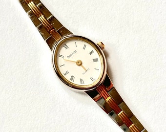 Reloj vintage Accurist para mujer: reloj de pulsera ovalado de dos tonos de los años 90