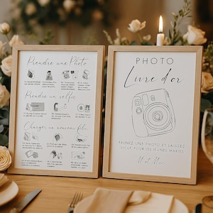 Könnte beinhalten: Zwei gerahmte Schilder mit hellen Holzrahmen. Ein Schild enthält Anweisungen auf Französisch zum Fotografieren und für Selfies. Das andere Schild lautet "PHOTO Livre d'or" mit einer Kameraillustration und Text auf Französisch. Eine brennende Kerze ist im Hintergrund.