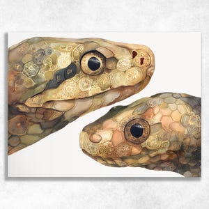 May include: A print showing two snake heads, with detailed scales in brown, tan, and gold. The scales have intricate patterns. The snakes' eyes are dark and prominent against the lighter skin tones. The artwork has a detailed, textured appearance.