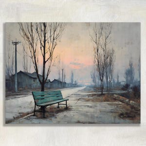 May include: A painting of a weathered teal wooden bench positioned on the side of a paved road. The scene features bare trees, utility poles, and distant buildings under a soft, pale pink and grey sunset sky, creating a quiet, muted atmosphere.