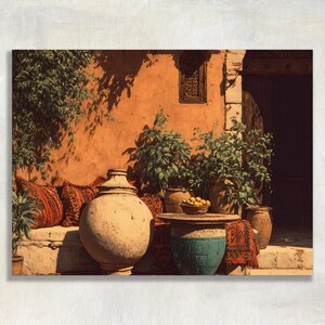 May include: A scene featuring a large, round, light-colored ceramic vessel, a smaller turquoise-colored ceramic base supporting a bowl of yellow fruit, and several patterned red and brown textiles arranged against a warm, orange-toned wall.