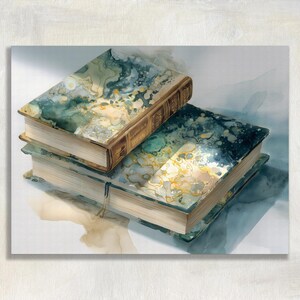 May include: A stack of two hardcover books with marbled teal and gold covers. The top book is smaller and has a brown leather spine. The edges of the pages are beige. The books are on a white surface.
