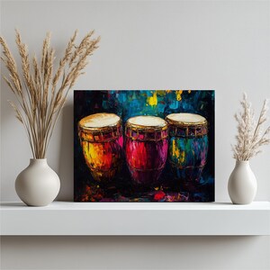 May include: An abstract painting of three conga drums. The drums are painted in vibrant colours: yellow, red, and blue. The background is a mix of dark blue and yellow brushstrokes. The drums are set against a dark background.