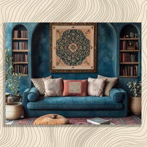 May include: A teal blue sofa with several decorative pillows sits in front of a teal wall with built-in bookshelves. A framed tapestry with a floral design hangs above the sofa. The room has a cozy, bohemian aesthetic.