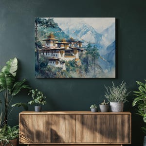 May include: Watercolor painting of a traditional Bhutanese temple complex nestled in a mountain landscape. The buildings feature white walls, gold roofs, and intricate details. The background shows snow-capped mountains and a blue sky.