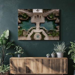 May include: A framed canvas print of an aerial view of a stone structure with a central pool of water. The structure features staircases, walkways, and lush greenery, creating a serene and architectural landscape.