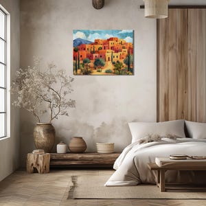 Warm toned pueblo hillside with arched doorways, small windows, and layered homes.
