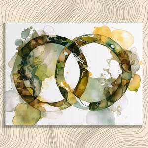 May include: Abstract watercolor painting featuring two overlapping circles in shades of green, brown, and yellow. The artwork has a fluid, organic style with soft edges and a white background. The painting is on a rectangular canvas.