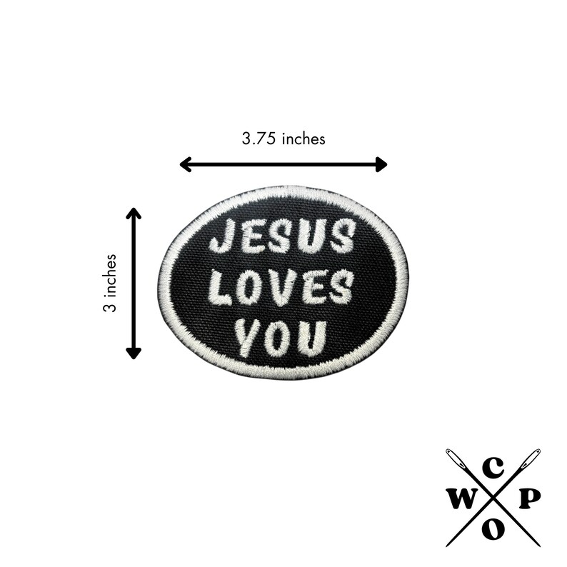 May include: Black and white embroidered iron-on patch with the text "JESUS LOVES YOU" in a white oval on a black background. The patch measures 3.75 inches wide and 3 inches tall.