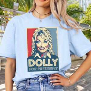 Dolly Parton Tshirt | Dolly for President | Dolly Parton Gifts | What Would Dolly Do | In Dolly We Trust | Dolly Parton Shirt | MAGA Light Blue