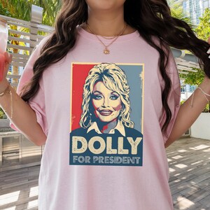 Dolly Parton Tshirt | Dolly for President | Dolly Parton Gifts | What Would Dolly Do | In Dolly We Trust | Dolly Parton Shirt | MAGA Light Pink