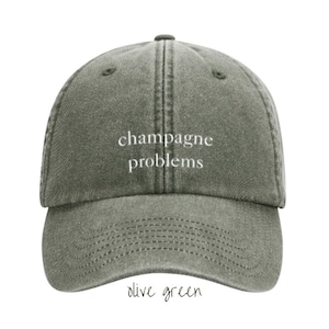 Cap Champagne Problems washed dad cap Taylor khaki olive dunkelgrün low profile baseballcap TheSwiftShopDE Tour Outfit Bild 1