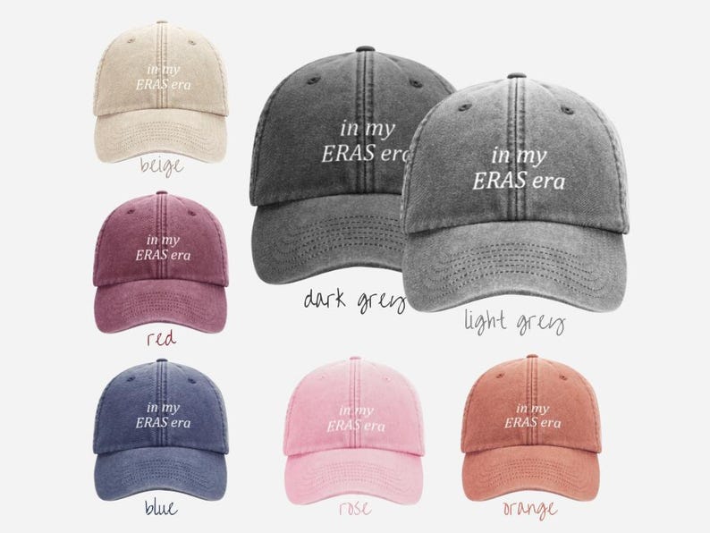 May include: A set of ten baseball caps in various colors, each featuring the text "in my ERAS era" embroidered on the front. The caps are made of a soft, distressed denim fabric.