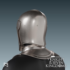 May include: A silver-colored knight's helmet, featuring a rounded top and a neck guard. The helmet has a smooth, metallic finish and is designed to protect the head and neck. The HBO Original logo and the text "A Knight of the Seven Kingdoms" are visible.