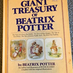 May include: A hardcover book titled Giant Treasury of Beatrix Potter with a yellow cover. The front features dark blue text and three illustrations of anthropomorphic animals. It lists several stories and includes the author's name.