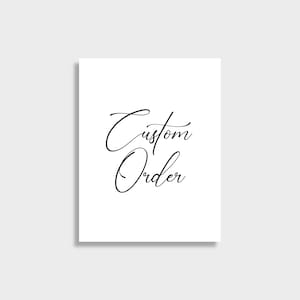 May include: A white card with the words "Custom Order" written in elegant black cursive script. The text is centered on the card, creating a clean and simple design. The background is a solid white.