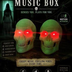 May include: A Halloween music box with two green skulls and red glowing eyes. The text on the box reads "Skull Motion Sensor Music Box" and "Creepy Music. Chilling Vibes. Every Time."