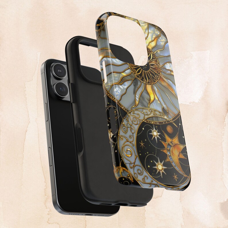 May include: A black phone case with a celestial design featuring a sun, moon, and stars in gold and blue. The case is shown in three parts, with the phone visible on the left. The design has a stained glass effect.