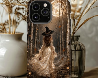 May include: A smartphone case featuring a graphic illustration of a figure wearing a wide-brimmed witch hat and a flowing, light-colored gown walking through a dark forest at night. A large, bright full moon illuminates the birch trees and falling leaves.