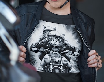 May include: A black t-shirt with a graphic of two cats wearing motorcycle helmets and riding a motorcycle. The cats are in black and white, and the motorcycle is in black and white.