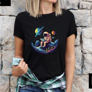Astro-Reader Tee, Unisex Space Shirt, Cute Astronaut Graphic Tee, Astronaut in Space Shirt, Outer Space T-Shirt