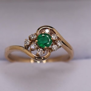 14K yellow gold emerald ring with diamonds